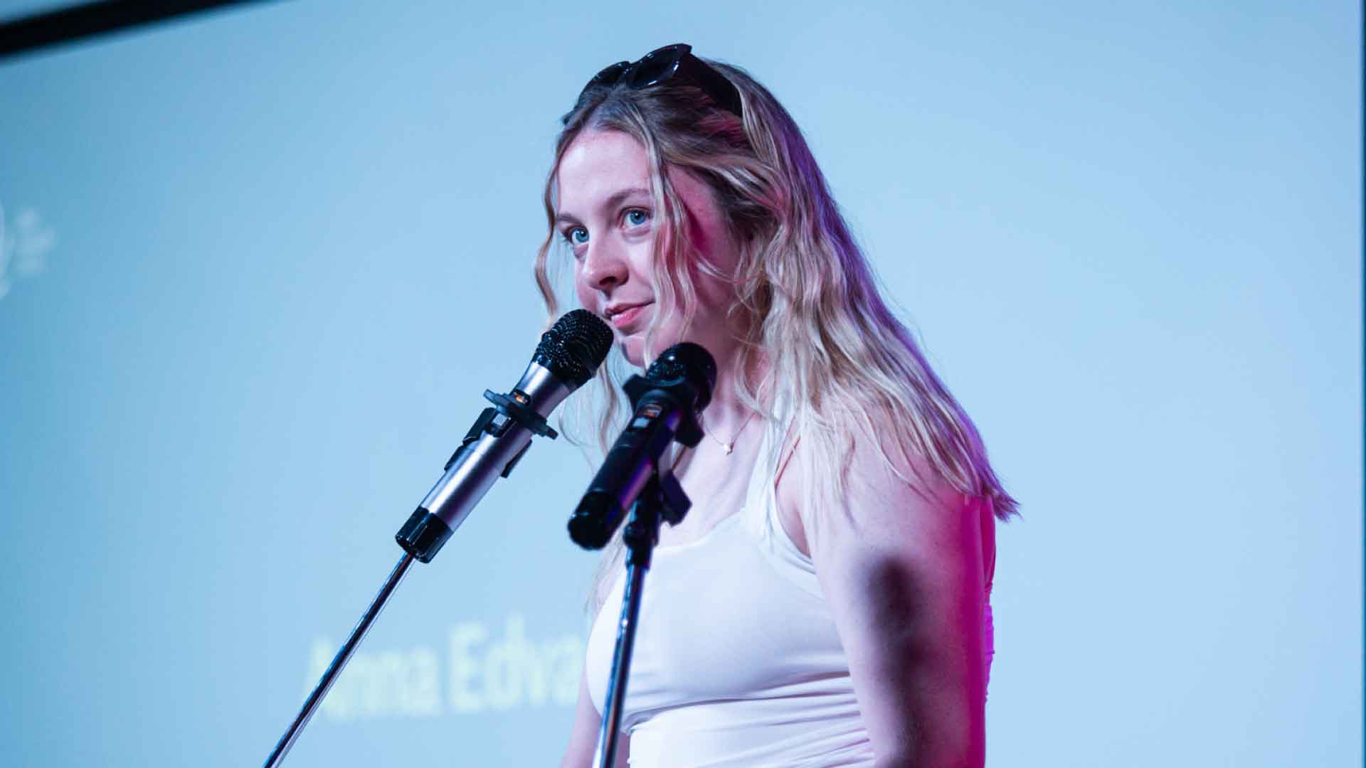 Student with microphone.