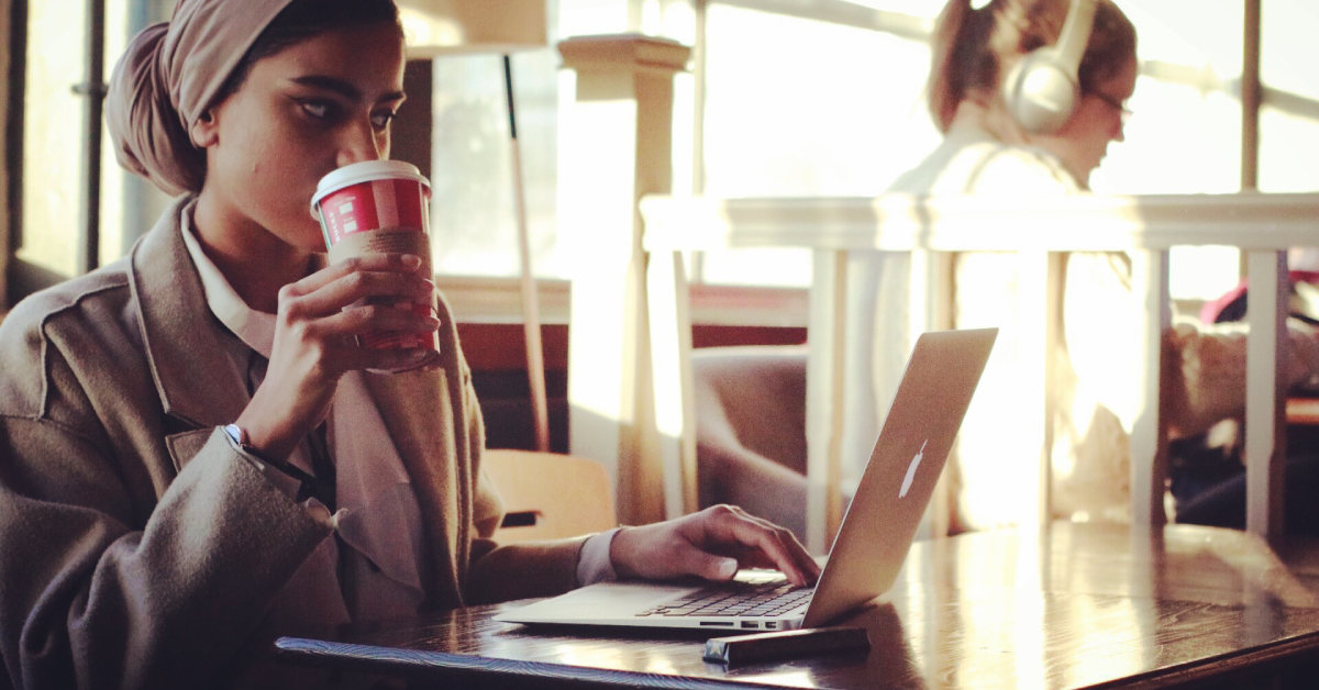 Girl with coffee and laptop in Recharge