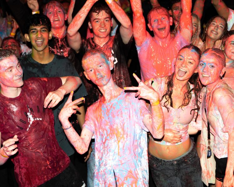 Students posing at paint party.
