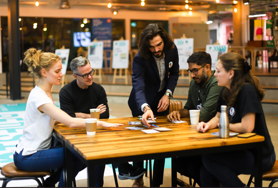 Individuals participating in climate fresk workshop