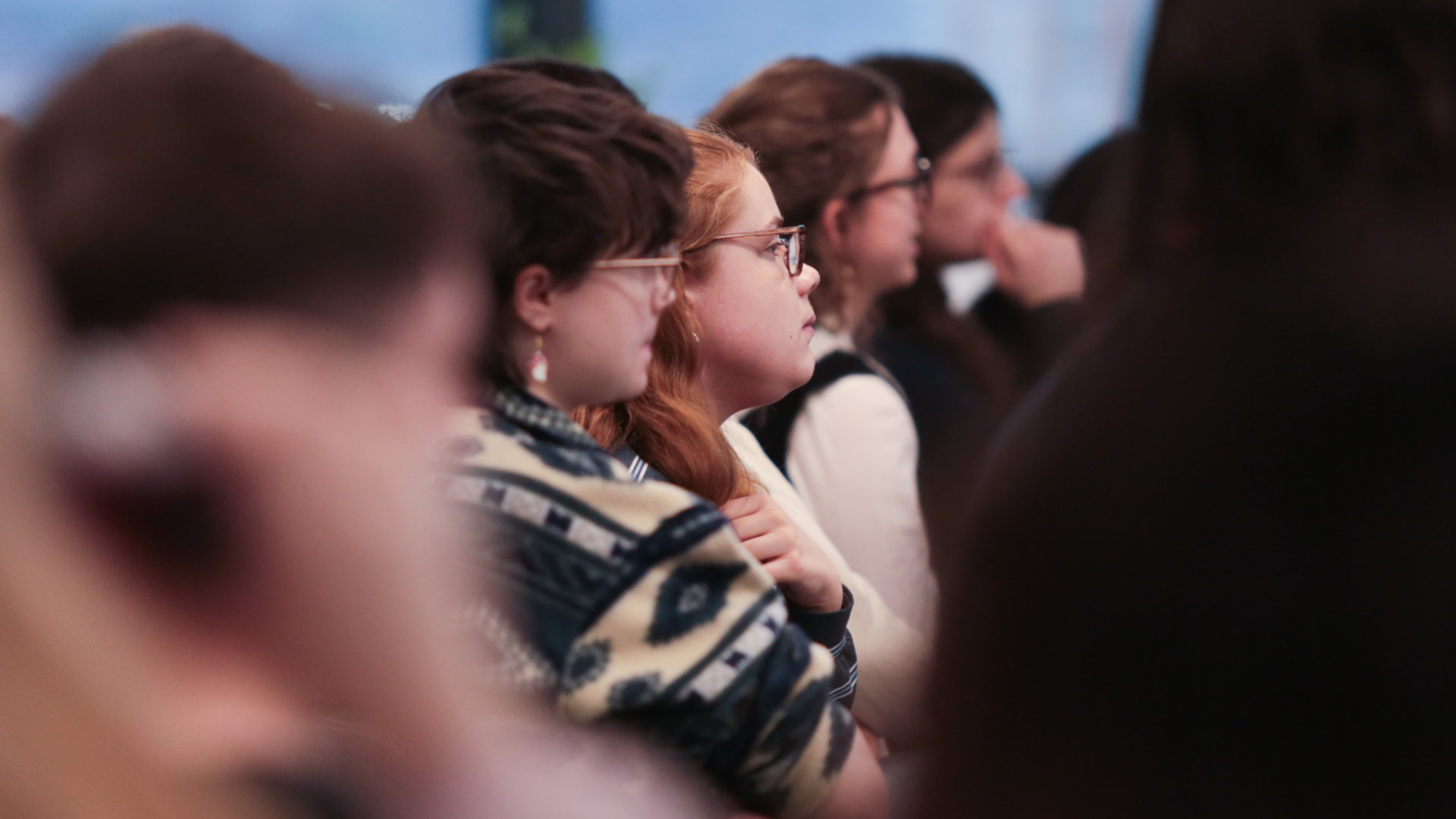 Close up of students attending meeting