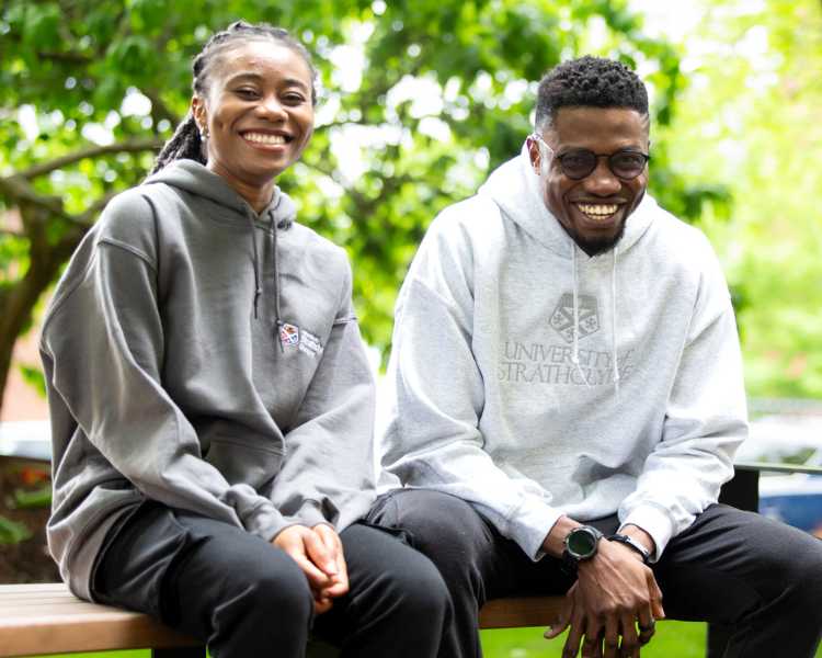 Students wearing grey Strathclyde merch hoodies