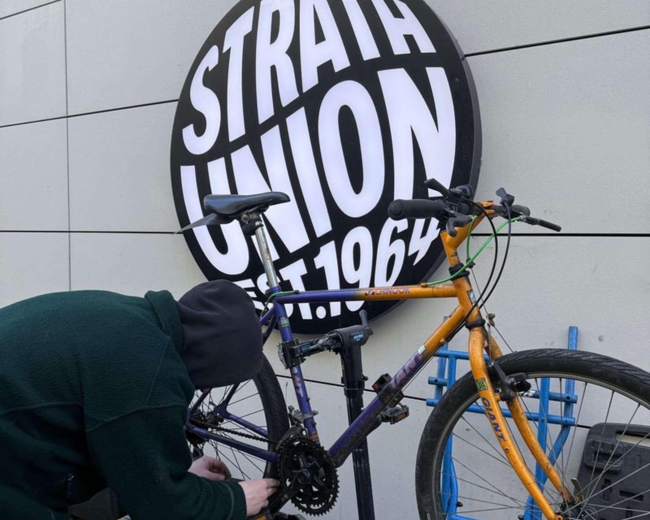 Bike repair stall set up outside Union building.