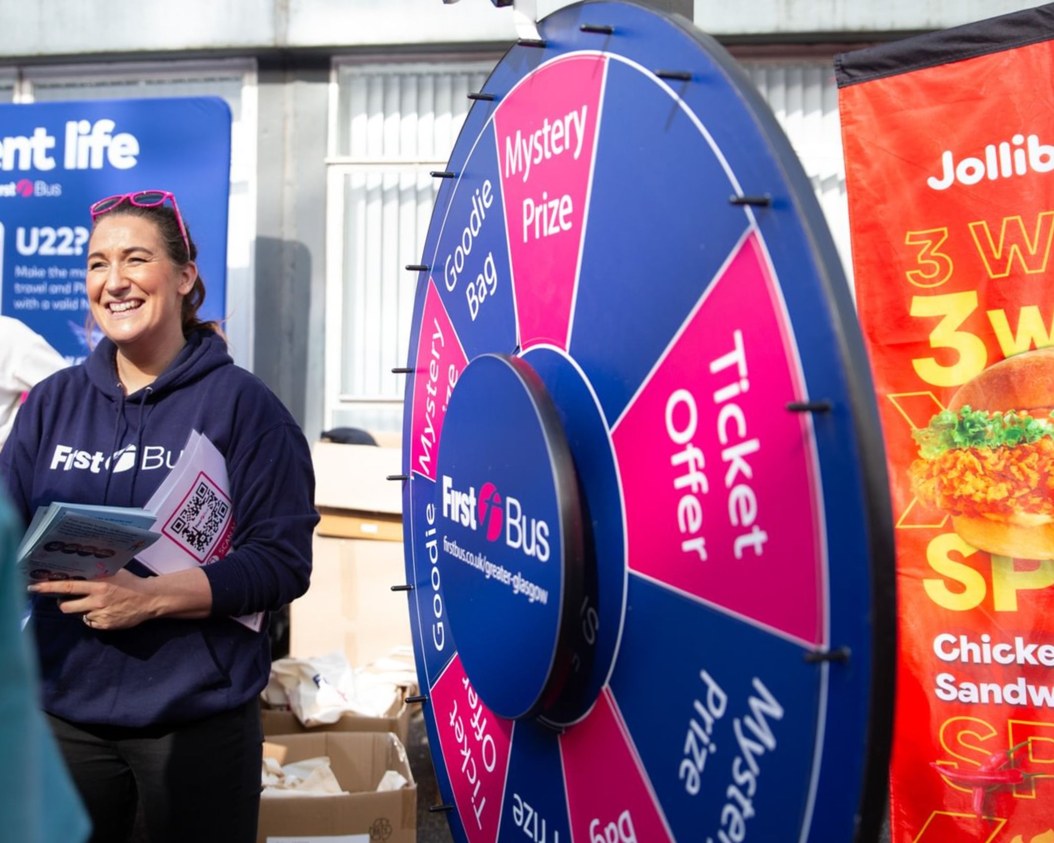Students outside Strath Union building during Freshers Fair with stalls
