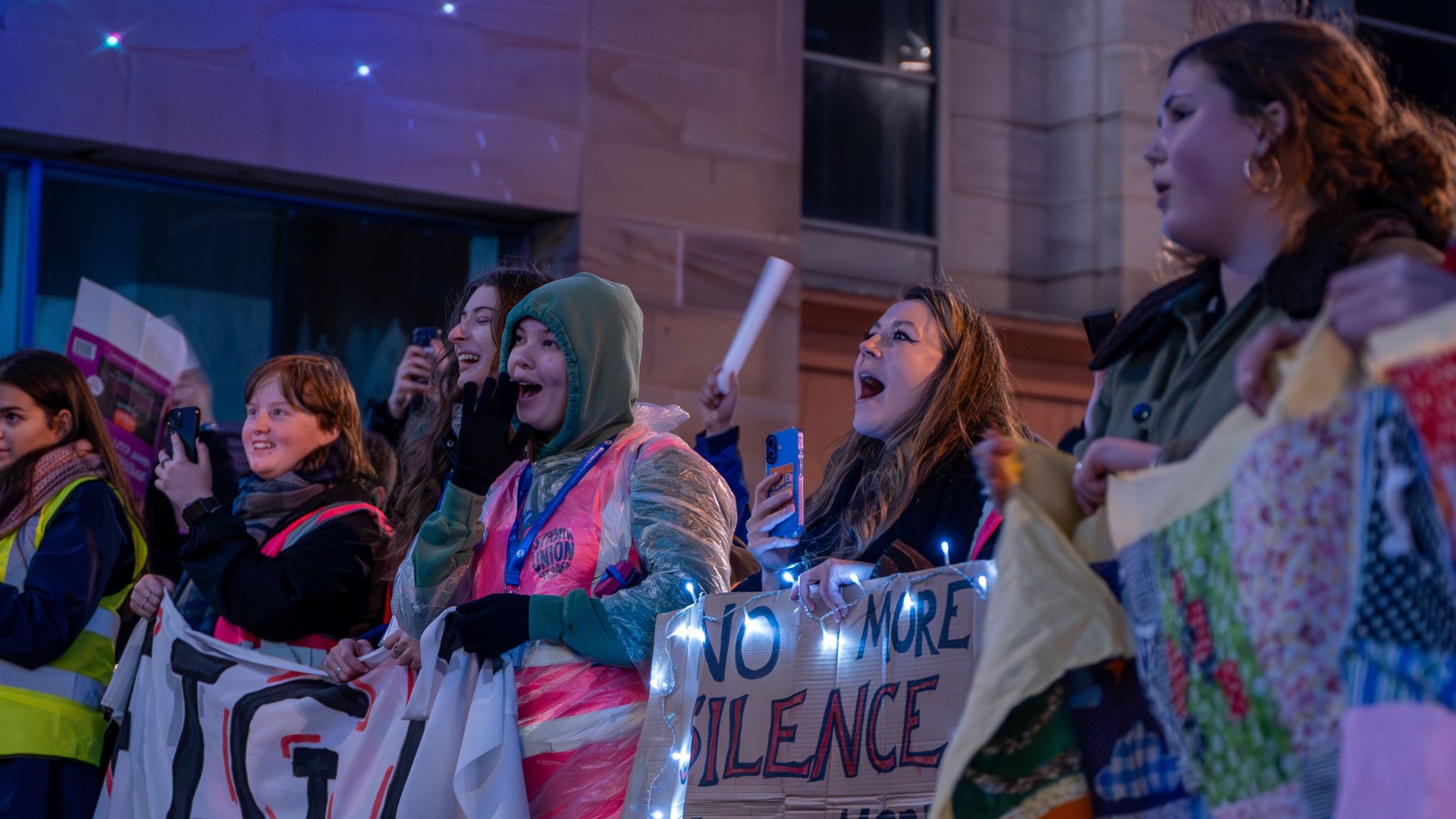 Strath students at Fight for the Night march holding cardboard signs saying ‘No More Silence’.