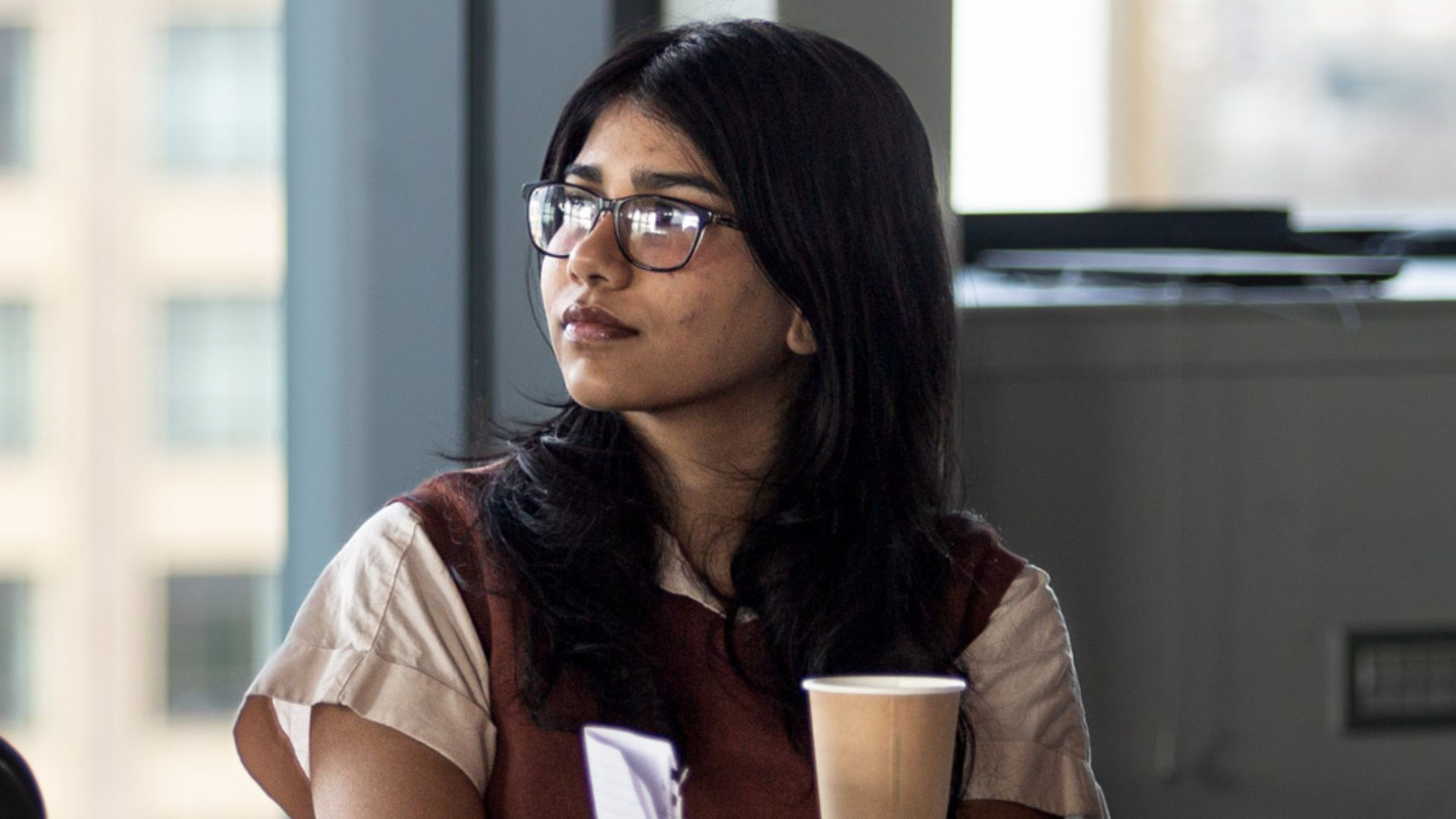 Student watching presentation at event