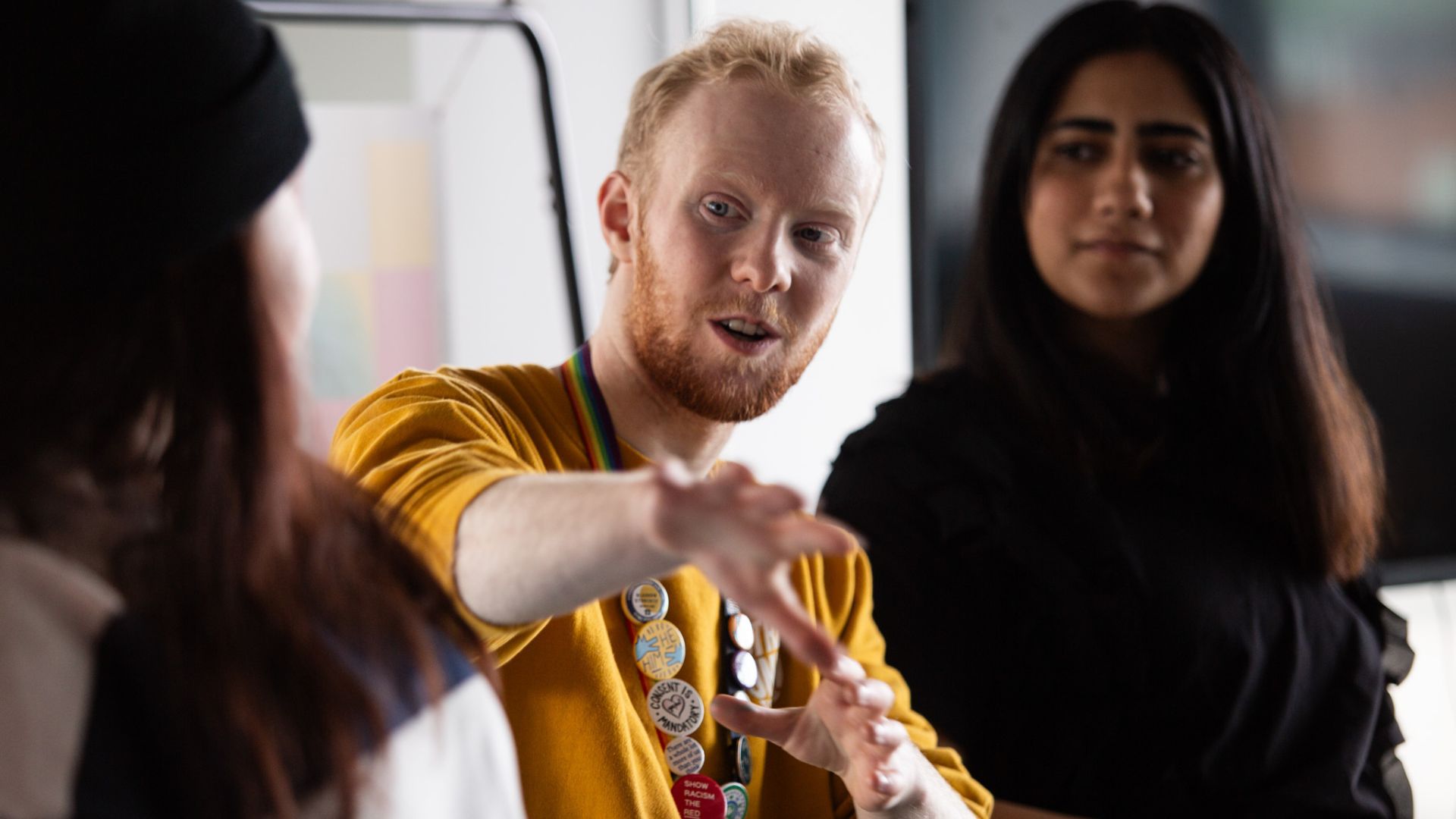 Student point directly at camera