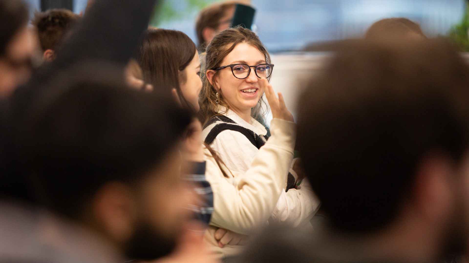 Student in crowd smiling