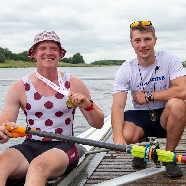 A couple of men on a boatDescription automatically generated with low confidence